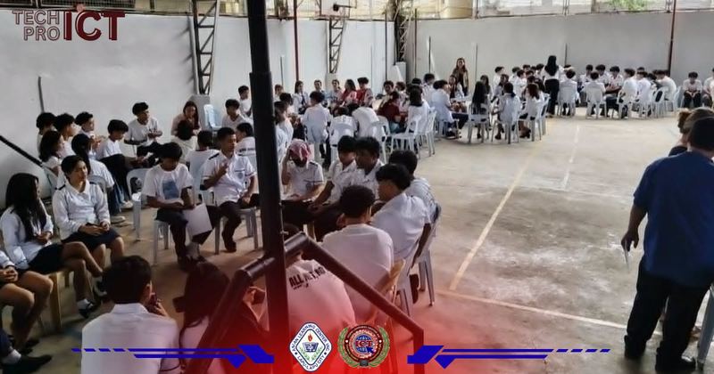 Wide view of campus assembly with Philippine flag